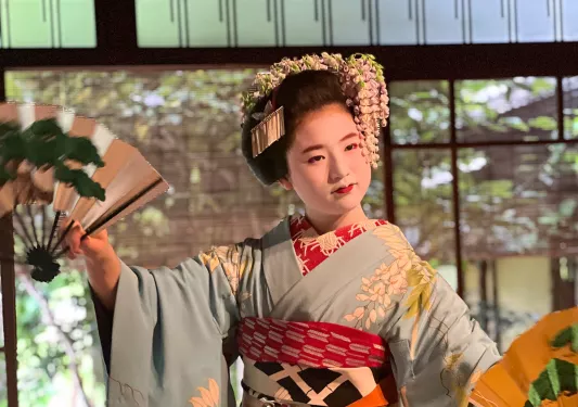 Japanese woman in a kimono performing