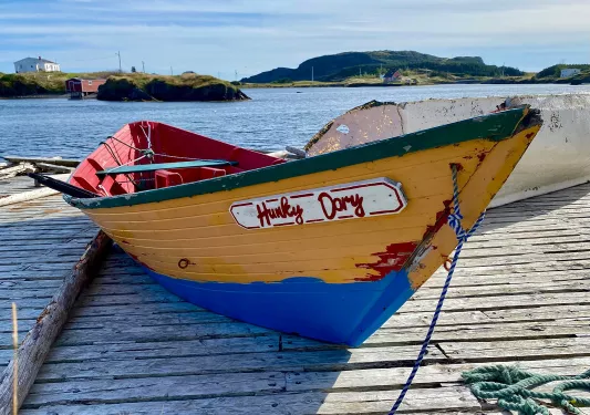 Close-up of small boat, the "HUNKY DORY", on a pier.