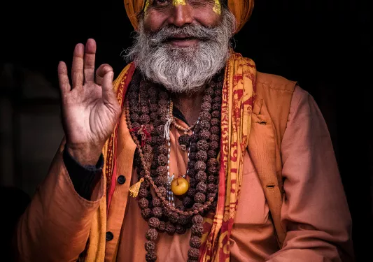 Old man with a beard and turban in traditional clothes in Nepal