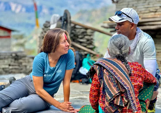 Backroads guests chatting with a local in Nepal