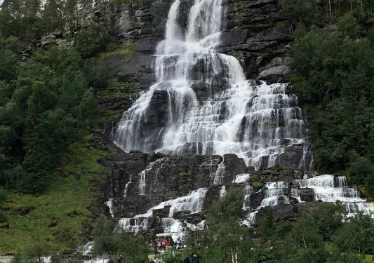 Waterfall cascading down a rocky cliff face in Norway