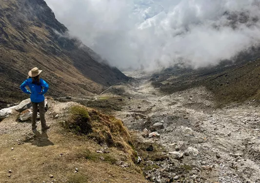 Guest overlooking foggy mountain range.
