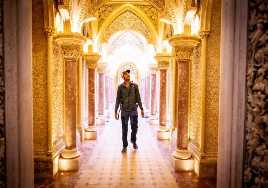 Guest walking through extravagant walkway. 