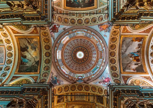 Shot of ceiling in domed church, mosaics and art on ceiling. 