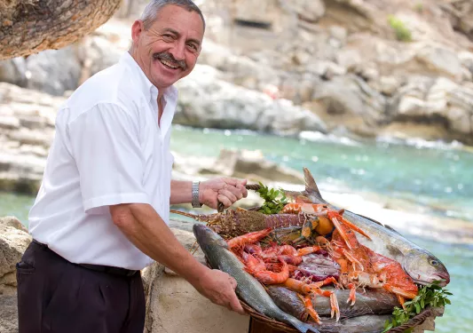 Local on coast with seafood platter.