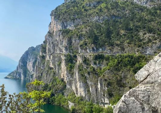Wide shot of craggy, Italian coast cliffs. Ocean to left.