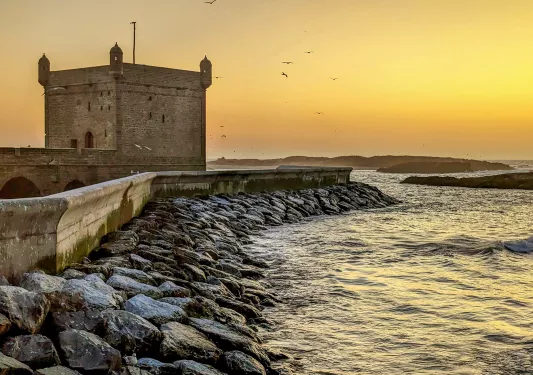 Shot of Moroccan coast, square stone building.