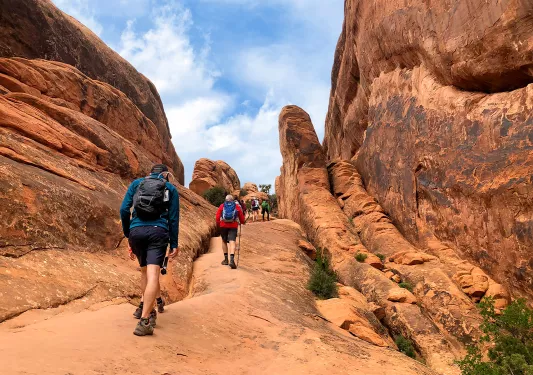 Guests hiking up canyon trails