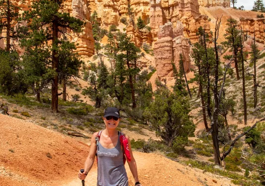 Guest walking on dirt trail