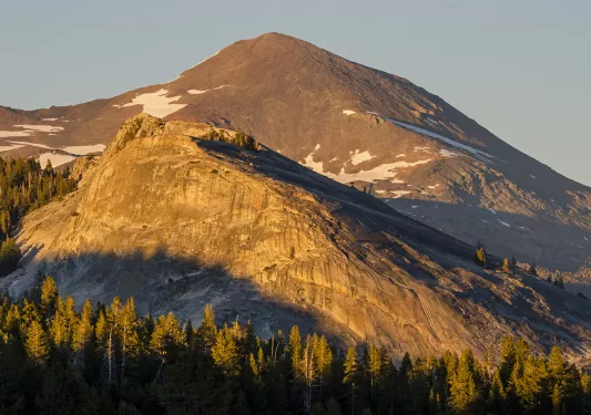 Wide shot of semi-snowy mountain.