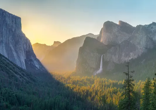 Wide shot of mountains at sunset.