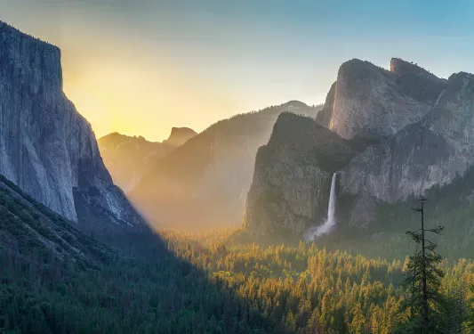 Wide shot of mountains at sunset.