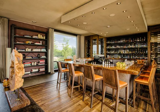 bar with shelves on wine bottles