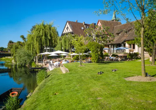 hotel and lawn next to water