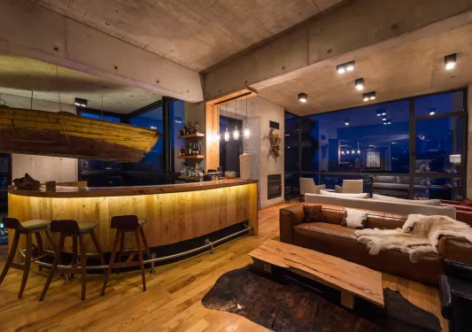 bar and couches in dimly lit room