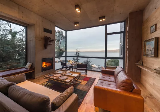 living room with fireplace and large windows