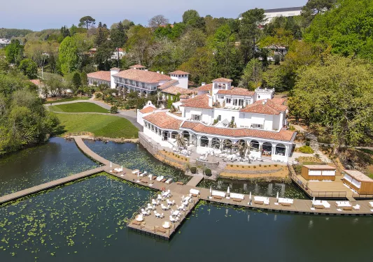 hotel on a dock with boats in the water