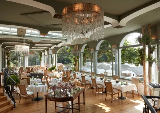 large restaurant dining room with glass chandelier