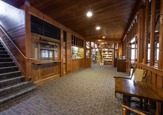 Lodge wooden interior with skylights leading to a store