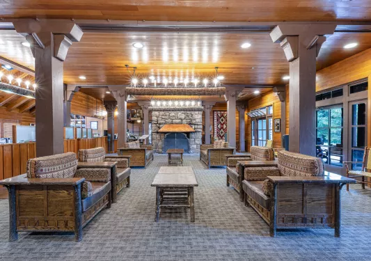 Indoor lobby with couches and furniture made of woode