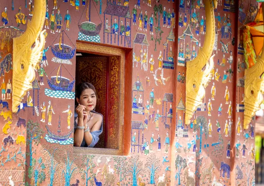 A woman looks out of a window