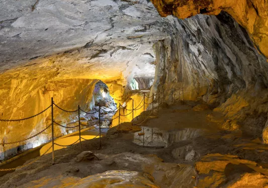 Cave illuminated by orange lights