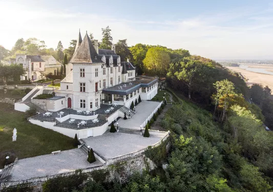 Exterior view of hotel, surrounded by trees