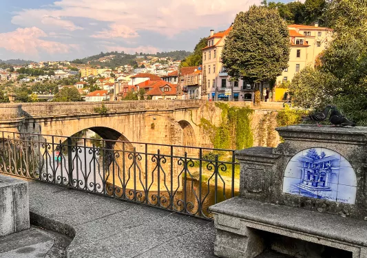Bridge leading to a rustic town