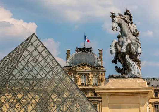 statue and pyramid at the louvre