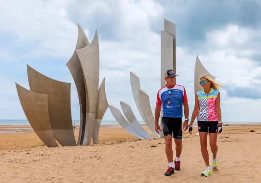 backroads guests walking next to statue