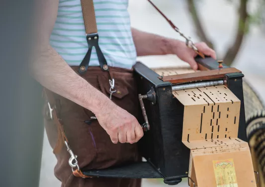 closeup of person playing instrument