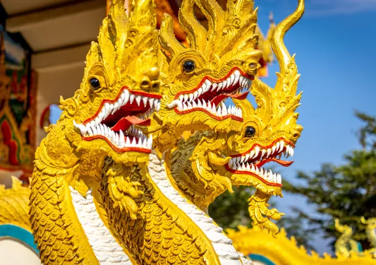 Three yellow dragon statues