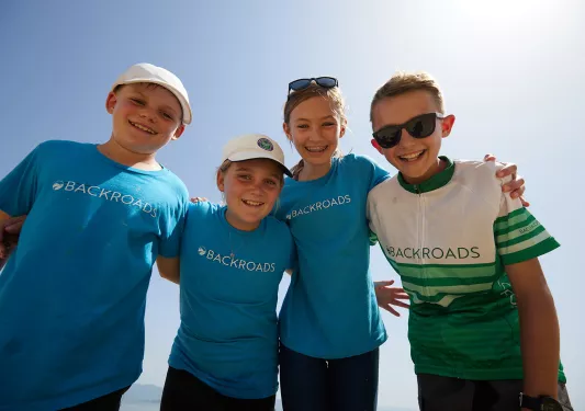 four children pose for a photo