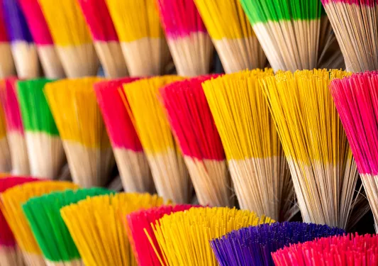 colorful incense stacked in bundles