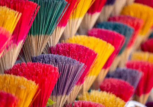 Vendor stall full of colorful incense sticks