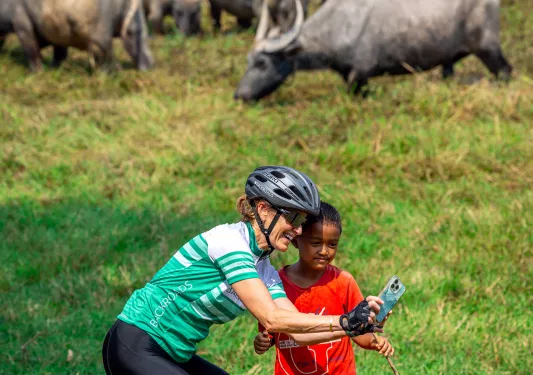 a woman takes a selfie with a child