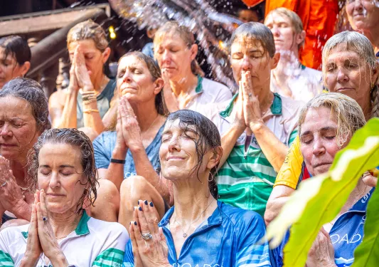 people getting splashed with water during ceremony