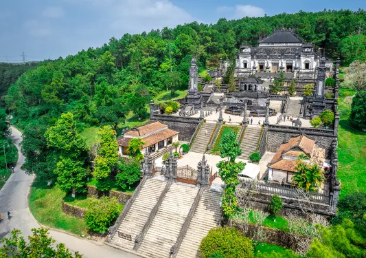 A temple with many steps built into a mountain side