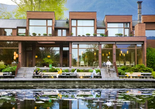 exterior of hotel and deck on the river