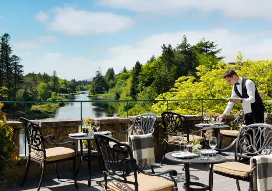 patio with bistro tables overlooking water