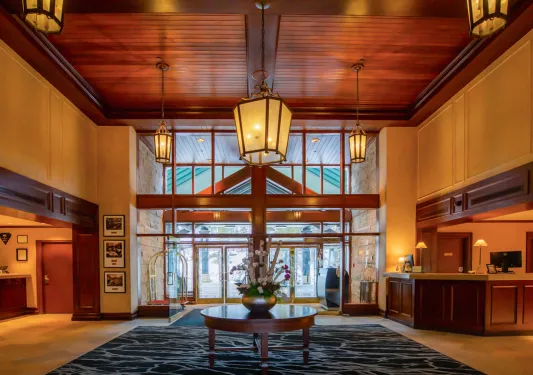 Hotel lobby with warm light fixtures hanging from the ceiling