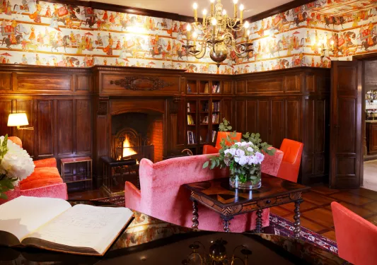 red sofa in front of fireplace