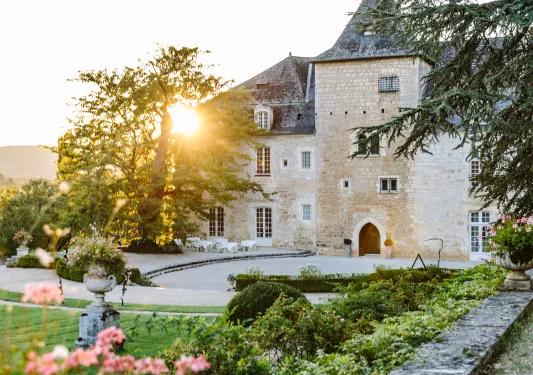 Castle building surrounded by gardens