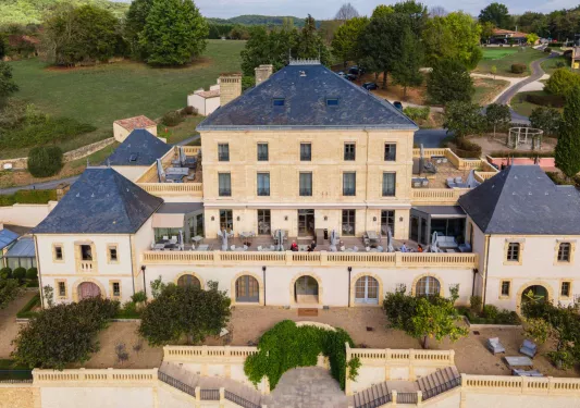 outdoor courtyard of stone hotel building
