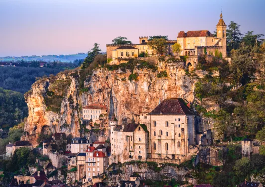 stone buildings along cliffside