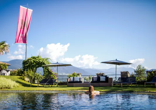 guest in a pool looking at the view