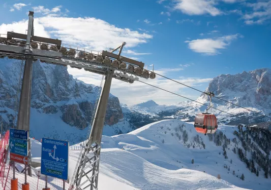 A gondola goes up a ski mountain