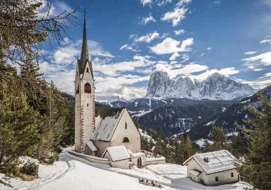 Snow covers a church