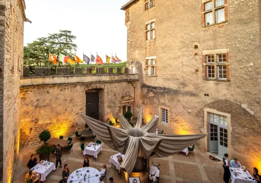 stone outdoor dining area with people eating