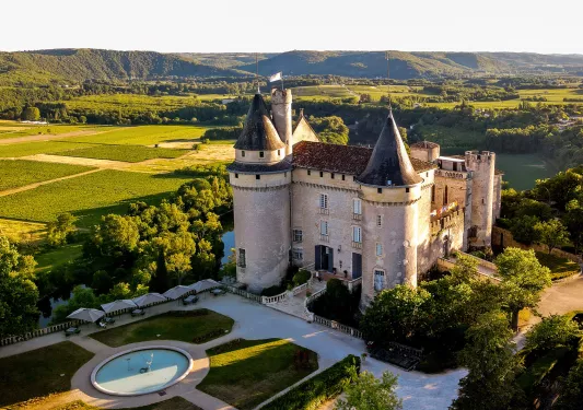 stone castle with fountain in the front